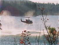 Helicopter taking on water from Bass Lake